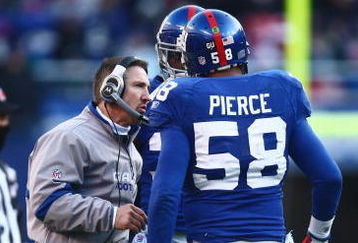 EAST RUTHERFORD, NJ -  JANUARY 11:  Defensive Coordinator Steve Spagnuolo of the New York Giants talks with Antonio Pierce against the Philadelphia Eagles during the NFC Divisional Playoff Game on January 11, 2009 at Giants Stadium in East Rutherford, New Jersey.  The Eagles defeated the Giants 23 -11. (Photo by Chris McGrath/Getty Images)