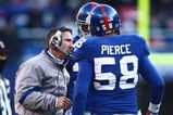 EAST RUTHERFORD, NJ -  JANUARY 11:  Defensive Coordinator Steve Spagnuolo of the New York Giants talks with Antonio Pierce against the Philadelphia Eagles during the NFC Divisional Playoff Game on January 11, 2009 at Giants Stadium in East Rutherford, New Jersey.  The Eagles defeated the Giants 23 -11. (Photo by Chris McGrath/Getty Images)