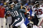 PHILADELPHIA, PA - JANUARY 11:  James Thrash #80 of the Philadelphia Eagles scores a touchdown in the 4th quarter putting them ahead 20-6 against the Atlanta Falcons during their NFC playoff game on January 11, 2003 at Veterans Stadium in Philadelphia, Pennsylvania.  (Photo by Al Bello/Getty Images)