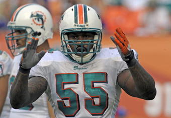 MIAMI, FL - JANUARY 4:  Linebacker Joey Porter #55 of the Miami Dolphins sets on defense against the Baltimore Ravens in an NFL Wildcard Playoff Game at Dolphins Stadium on January 4, 2009 in Miami, Florida.  (Photo by Al Messerschmidt/Getty Images) 