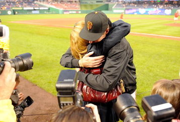 WASHINGTON - JUNE 04:  Randy Johnson #51 of the San Francisco Giants hugs his wife Lisa after winning his 300th career game against the Washington Nationals at Nationals Park on June 4, 2009 in Washington, DC.  The Giants won the game 5-1.  (Photo by Greg Fiume/Getty Images)