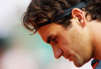 PARIS - JUNE 05:  Roger Federer of Switzerland gathers his thoughts during the Men's Singles Semi Final match against Juan Martin Del Potro of Argentina on day thirteen of the French Open at Roland Garros on June 5, 2009 in Paris, France.  (Photo by Clive Brunskill/Getty Images)