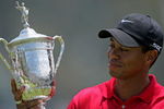 SAN DIEGO - JUNE 16:  Tiger Woods celebrates with the trophy after winning on the first sudden death playoff hole during the playoff round of the 108th U.S. Open at the Torrey Pines Golf Course (South Course) on June 16, 2008 in San Diego, California.  (Photo by Doug Pensinger/Getty Images)