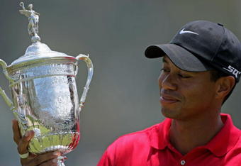 SAN DIEGO - JUNE 16:  Tiger Woods celebrates with the trophy after winning on the first sudden death playoff hole during the playoff round of the 108th U.S. Open at the Torrey Pines Golf Course (South Course) on June 16, 2008 in San Diego, California.  (Photo by Doug Pensinger/Getty Images)