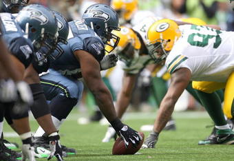 SEATTLE - OCTOBER 12:  Center Chris Spencer #65 of the Seattle Seahawks lines up against the Green Bay Packers defense during the game on October 12, 2008 at Qwest Field in Seattle, Washington. The Packers defeated the Seahawks 27-17. (Photo by Otto Greule Jr./Getty Images)