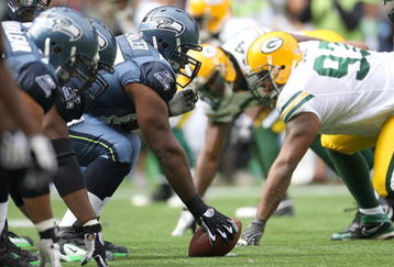 SEATTLE - OCTOBER 12:  Center Chris Spencer #65 of the Seattle Seahawks lines up against the Green Bay Packers defense during the game on October 12, 2008 at Qwest Field in Seattle, Washington. The Packers defeated the Seahawks 27-17. (Photo by Otto Greule Jr./Getty Images)