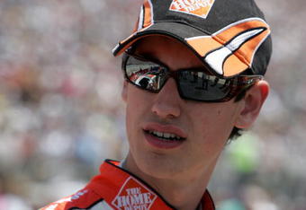 DOVER, DE - MAY 31:  Joey Logano, driver of the #20 Home Depot Toyota, stands on the grid prior to the start of the NASCAR Sprint Cup Series Autism Speaks 400 at Dover International Speedway on May 31, 2009 in Dover, Delaware.  (Photo by Jerry Markland/Getty Images for NASCAR)