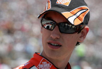 DOVER, DE - MAY 31:  Joey Logano, driver of the #20 Home Depot Toyota, stands on the grid prior to the start of the NASCAR Sprint Cup Series Autism Speaks 400 at Dover International Speedway on May 31, 2009 in Dover, Delaware.  (Photo by Jerry Markland/Getty Images for NASCAR)