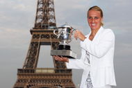 PARIS - JUNE 06:  New ladies French Open champion Svetlana Kuznetsova of Russia poses with the trophy in front of the Eiffel Tower on day fourteen of the French Open on June 6, 2009 in Paris, France.  (Photo by Ryan Pierse/Getty Images)