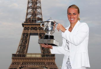 PARIS - JUNE 06:  New ladies French Open champion Svetlana Kuznetsova of Russia poses with the trophy in front of the Eiffel Tower on day fourteen of the French Open on June 6, 2009 in Paris, France.  (Photo by Ryan Pierse/Getty Images)