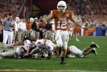 GLENDALE, AZ - JANUARY 05:  Quarterback Colt McCoy #12 of the Texas Longhorns scores on a 14 yard touchdown rush against the Ohio State Buckeyes during the third quarter of the Tostitos Fiesta Bowl Game on January 5, 2009 at University of Phoenix Stadium in Glendale, Arizona.  (Photo by Jed Jacobsohn/Getty Images)