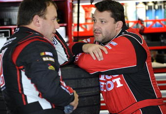 LONG POND, PA - JUNE 06:  Ryan Newman (L), driver of the #39 Haas Automation/US Army Chevrolet, talks with teammate Tony Stewart (R), driver of the #14 Old Spice/Office Depot Chevrolet, in the garage during practice for the NASCAR Sprint Cup Series Pocono 500 on June 6, 2009 at Pocono International Raceway in Long Pond, Pennsylvania.  (Photo by John Harrelson/Getty Images for NASCAR)