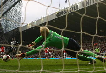 NEWCASTLE, UNITED KINGDOM - MARCH 21:  Obafemi Martins of Newcastle United takes a penalty kick, which was saved by Manuel Almunia of Arsenal during the Barclays Premier League match between Newcastle United and Arsenal at St James' Park on March 21, 2009 in Newcastle, England.  (Photo by Julian Finney/Getty Images)