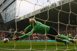 NEWCASTLE, UNITED KINGDOM - MARCH 21:  Obafemi Martins of Newcastle United takes a penalty kick, which was saved by Manuel Almunia of Arsenal during the Barclays Premier League match between Newcastle United and Arsenal at St James' Park on March 21, 2009 in Newcastle, England.  (Photo by Julian Finney/Getty Images)