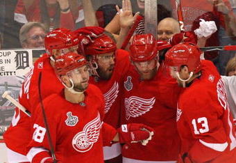 DETROIT - JUNE 06:  Dan Cleary #11 of the Detroit Red Wings celebrates his goal against the Pittsburgh Penguins with Nicklas Lidstrom #5, Brian Rafalski #28, Henrik Zetterberg #40 and Pavel Datsyuk #13 during Game Five of the 2009 NHL Stanley Cup Finals at Joe Louis Arena on June 6, 2009 in Detroit, Michigan.  (Photo by Claus Andersen/Getty Images)