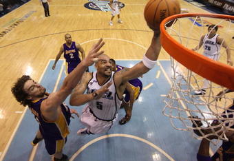 SALT LAKE CITY - APRIL 23:  Carlos Boozer #5 of the Utah Jazz shoots against Pau Gasol #16 of the Los Angeles Lakers in Game Three of the Western Conference Quarterfinals during the 2009 NBA Playoffs at Energy Solutions Arena on April 23, 2009 in Salt Lake City, Utah. NOTE TO USER: User expressly acknowledges and agrees that, by downloading and/or using this Photograph, user is consenting to the terms and conditions of the Getty Images License Agreement. Mandatory Copyright Notice: Copyright 2009 Getty Images (Photo by Otto Greule Jr/Getty Images)