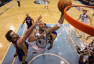 SALT LAKE CITY - APRIL 23:  Carlos Boozer #5 of the Utah Jazz shoots against Pau Gasol #16 of the Los Angeles Lakers in Game Three of the Western Conference Quarterfinals during the 2009 NBA Playoffs at Energy Solutions Arena on April 23, 2009 in Salt Lake City, Utah. NOTE TO USER: User expressly acknowledges and agrees that, by downloading and/or using this Photograph, user is consenting to the terms and conditions of the Getty Images License Agreement. Mandatory Copyright Notice: Copyright 2009 Getty Images (Photo by Otto Greule Jr/Getty Images)