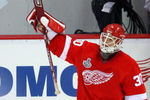 DETROIT - JUNE 06:  Goaltender Chris Osgood #30 of the Detroit Red Wings acknowledges the fans after a 5-0 win over the Pittsburgh Penguins in Game Five of the 2009 NHL Stanley Cup Finals at Joe Louis Arena on June 6, 2009 in Detroit, Michigan.  (Photo by Jim McIsaac/Getty Images)