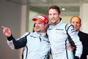 MONTE CARLO, MONACO - MAY 24:  First placed Jenson Button (R) of Great Britain and Brawn GP celebrates with second placed team mate Rubens Barrichello (L) of Brazil and Brawn GP after winning the Monaco Formula One Grand Prix at the Monte Carlo Circuit on May 24, 2009 in Monte Carlo, Monaco.  (Photo by Paul Gilham/Getty Images)