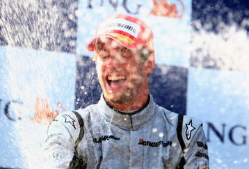 ISTANBUL, TURKEY - JUNE 07:  Jenson Button of Great Britain and Brawn GP celebrates on the podium after winning the Turkish Formula One Grand Prix at Istanbul Park on June 7, 2009, in Istanbul, Turkey.  (Photo by Clive Mason/Getty Images)
