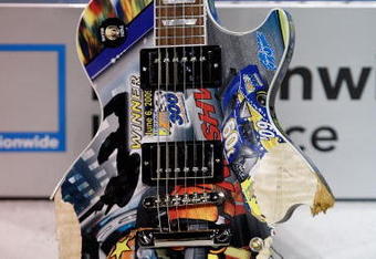 NASHVILLE, TN - JUNE 06:  The Gibson Guitar painted by Sam Bass sits in victory lane after being destroyed by Kyle Busch, driver of the #18 NOS Energy Drink Toyota after winning the NASCAR Nationwide Series Federated Auto Parts 300 at the Nashville Superspeedway on June 6, 2009 in Lebanon,Tennessee.  (Photo by Chris Graythen/Getty Images for NASCAR)