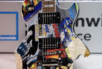 NASHVILLE, TN - JUNE 06:  The Gibson Guitar painted by Sam Bass sits in victory lane after being destroyed by Kyle Busch, driver of the #18 NOS Energy Drink Toyota after winning the NASCAR Nationwide Series Federated Auto Parts 300 at the Nashville Superspeedway on June 6, 2009 in Lebanon,Tennessee.  (Photo by Chris Graythen/Getty Images for NASCAR)