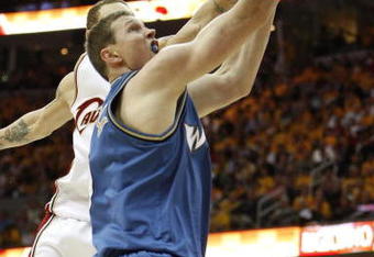CLEVELAND - APRIL 30: Darius Songaila #9 of the Washington Wizards goes up for a shot against Delonte West #13 of the Cleveland Cavaliers during Game Five of the Eastern Conference Quarterfinals during the 2008 NBA Playoffs at Quicken Loans Arena on April 30, 2008 in Cleveland, Ohio. Washington won the game 88-87 but trail in the series 2-3. NOTE TO USER: User expressly acknowledges and agrees that, by downloading and or using this photograph, User is consenting to the terms and conditions of the Getty Images License Agreement.  (Photo by Gregory Shamus/Getty Images)