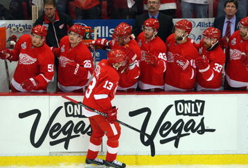 DETROIT - JUNE 06:  Pavel Datsyuk #13 of the Detroit Red Wings celebrates after a goal against the Pittsburgh Penguins during Game Five of the 2009 NHL Stanley Cup Finals at Joe Louis Arena on June 6, 2009 in Detroit, Michigan.  (Photo by Jim McIsaac/Getty Images)