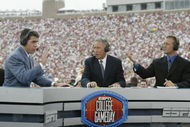 TALLAHASSEE, FL - OCTOBER 26: ESPN College GameDay announcers (l to r) Chris Fowler, Lee Corso and Kirk Herbstreit comment during the NCAA football game between Notre Dame and Florida State at Doak Campbell Stadium on October 26, 2002 in Tallahassee, Florida. The Notre Dame Fighting Irish defeated the Florida State Seminoles 34-24. (Photo by Craig Jones/Getty Images)
