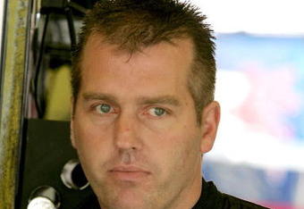 DARLINGTON, SC - MAY 08: Jeremy Mayfield, driver of the #41 SmallSponsor.com Toyota, stands in the garage during practice for the NASCAR Sprint Cup Series Southern 500 on May 8, 2009 at Darlington Raceway in Darlington, South Carolina.  (Photo by Jerry Markland/Getty Images for NASCAR)