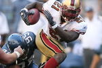 SEATTLE - SEPTEMBER 14:  Running back Frank Gore #21 of the San Francisco 49ers rushes against Lawrence Jackson #95 of the Seattle Seahawks on September 14, 2008 at Qwest Field in Seattle Washington. The 49ers defeated the Seahawks 33-30 in overtime. (Photo by Otto Greule Jr/Getty Images)