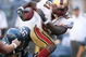 SEATTLE - SEPTEMBER 14:  Running back Frank Gore #21 of the San Francisco 49ers rushes against Lawrence Jackson #95 of the Seattle Seahawks on September 14, 2008 at Qwest Field in Seattle Washington. The 49ers defeated the Seahawks 33-30 in overtime. (Photo by Otto Greule Jr/Getty Images)