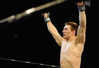 UNCASVILLE, CT - MAY 16: Frank Latina (L) celebrates after beating John Franchi (R) of The Bomb Squad during their bout presented by the International Fighting League at the Mohegan Sun Arena May 16, 2008 in Uncasville, Connecticut.  (Photo by Jeff Zelevansky/Getty Images for IFL)