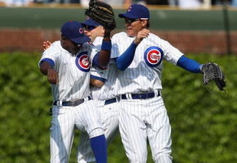 CHICAGO - MAY 29: (L-R) Alfonso Soriano #12, Reed Johnson #9 and Kosuke Fukudome #1 of the Chicago Cubs celebrate a win over the Los Angeles Dodgers on May 29, 2009 at Wrigley Field in Chicago, Illinois. The Cubs defeated the Dodgers 2-1. (Photo by Jonathan Daniel/Getty Images)