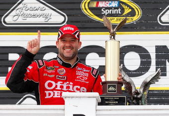 LONG POND, PA - JUNE 07:  Tony Stewart, driver of the #14 Office Depot/Old Spice Chevrolet, celebrates in victory lane after winning the NASCAR Sprint Cup Series Pocono 500 on June 7, 2009 at Pocono Raceway in Long Pond, Pennsylvania.  (Photo by Geoff Burke/Getty Images for NASCAR)