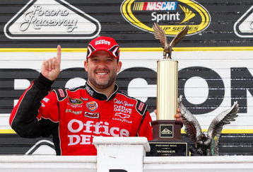 LONG POND, PA - JUNE 07:  Tony Stewart, driver of the #14 Office Depot/Old Spice Chevrolet, celebrates in victory lane after winning the NASCAR Sprint Cup Series Pocono 500 on June 7, 2009 at Pocono Raceway in Long Pond, Pennsylvania.  (Photo by Geoff Burke/Getty Images for NASCAR)