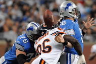 DETROIT - OCTOBER 05:  Alex Brown #96 of the Chicago Bears causes a fumble on a sack of Jon Kitna #8 of the Detroit Lions while defended by Jeff Backus #76 during the first quarter at Ford Field on October 5, 2008 in Detroit, Michigan.  The Bears won 34-7.   (Photo by Harry How/Getty Images)