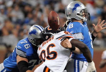 DETROIT - OCTOBER 05:  Alex Brown #96 of the Chicago Bears causes a fumble on a sack of Jon Kitna #8 of the Detroit Lions while defended by Jeff Backus #76 during the first quarter at Ford Field on October 5, 2008 in Detroit, Michigan.  The Bears won 34-7.   (Photo by Harry How/Getty Images)