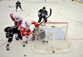 PITTSBURGH - JUNE 04:  Marian Hossa #81 of the Detroit Red Wings fights for position agianst Mark Eaton #7 of the Pittsburgh Penguins during Game Four of the 2009 NHL Stanley Cup Finals on June 4, 2009 at Mellon Arena in Pittsburgh, Pennsylvania.  (Photo by Jamie Sabau/Getty Images)