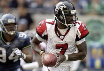 SEATTLE - SEPTEMBER 18: Michael Vick #7 of the Atlanta Falcons runs with the ball against the Seattle Seahawks during a game at Qwest Field on September 18, 2005 in Seattle, Washington. Seahawks won 21-18. (Photo by Otto Greule Jr/Getty Images)