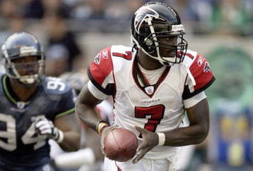 SEATTLE - SEPTEMBER 18: Michael Vick #7 of the Atlanta Falcons runs with the ball against the Seattle Seahawks during a game at Qwest Field on September 18, 2005 in Seattle, Washington. Seahawks won 21-18. (Photo by Otto Greule Jr/Getty Images)