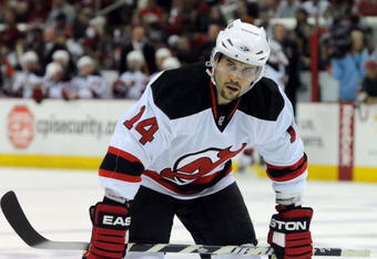 RALEIGH, NC - APRIL 26: Brian Gionta #14 of the the New Jersey Devils skates as he waits for a face-off in the first period of Game Six of the Eastern Conference Quarterfinals of the 2009 Stanley Cup Playoffs against the Carolina Hurricanes on April 26, 2009 at the RBC Center in Raleigh, North Carolina. (Photo by Steve Dykes/Getty Images)