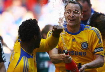 LONDON, ENGLAND - MAY 30:  John Terry (R) and John Obi Mikel of Chelsea celebrate victory after the FA Cup sponsored by E.ON Final match between Chelsea and Everton at Wembley Stadium on May 30, 2009 in London, England.  (Photo by Alex Livesey/Getty Images)