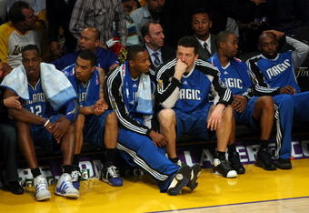 LOS ANGELES, CA - JUNE 04:  (L-R) Tyronn Lue #10, Dwight Howard #12, Courtney Lee #11, Rashard Lewis #9, Hedo Turkoglu #15, Rafer Alston #1 and Anthony Johnson #8 of the Orlando Magic sit on the bench in the second half against the Los Angeles Lakers in Game One of the 2009 NBA Finals at Staples Center on June 4, 2009 in Los Angeles, California. NOTE TO USER: User expressly acknowledges and agrees that, by downloading and or using this photograph, User is consenting to the terms and conditions of the Getty Images License Agreement.  (Photo by Stephen Dunn/Getty Images)