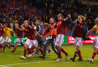 SOLNA, SWEDEN - JUNE 06:  Denmark players celebrate after their 1-0 victory at the final whistle in the FIFA2010 World Cup Qualifying Group 1 match between Sweden and Denmark at the Rasunda Stadium on June 6, 2009 in Solna, Sweden.  (Photo by Michael Steele/Getty Images)