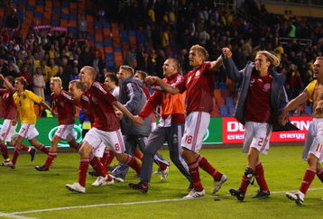 SOLNA, SWEDEN - JUNE 06:  Denmark players celebrate after their 1-0 victory at the final whistle in the FIFA2010 World Cup Qualifying Group 1 match between Sweden and Denmark at the Rasunda Stadium on June 6, 2009 in Solna, Sweden.  (Photo by Michael Steele/Getty Images)