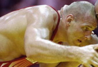 ATLANTA - JULY 23:  Alexander Karelin (left) of Russia and Siamak Ghaffari (right) of the USA square up to each other in their wrestling match on July 23, 1996 during the 1996 Olympic Games held in Atlanta, Georgia. (Photo by: Pascal Rondeau/Getty Images)