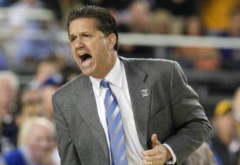 GLENDALE, AZ - MARCH 26:  Head Coach John Calipari of the Memphis Tigers adjusts his team against the Missouri Tigers in the Sweet 16 of the NCAA Division I Men's Basketball Tournament at the University of Phoenix Stadium on March 26, 2009 in Glendale, Arizona.  (Photo by Ronald Martinez/Getty Images)