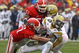 ATHENS, GA - NOVEMBER 29: Defensive teammates Chad Gloer #17 and Akeem Dent #51 of the Georgia Bulldogs tackle running back Roddy Jones #20 of the Georgia Tech Yellow Jackets while Jones' teammate Marcus Wright #3 tries to block during the game at Sanford Stadium on November 29, 2008 in Athens, Georgia. The Yellow Jackets defeated the Bulldogs 45-42. (Photo by Mike Zarrilli/Getty Images)