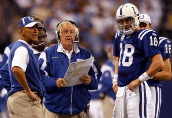 INDIANAPOLIS - NOVEMBER 16:  Payton Manning #18 of the Indianapolis Colts talks over a play with Head Coach Tony Dungy and Offensive Coordinator Tom Moore during the second quarter against the Houston Texans at Lucas Oil Stadium on November 16, 2008 in Indianapolis, Indiana.  (Photo by Harry How/Getty Images)